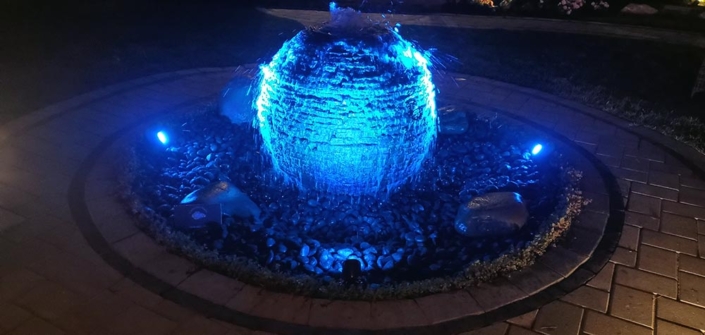 Outdoor sphere fountain, blue lights