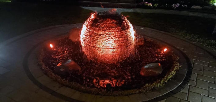 Outdoor sphere fountain, red LED lights
